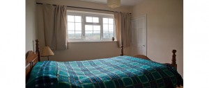 2nd double bedroom with wooden floors, cast iron fireplaces and beautiful views at The Pink House Lulworth