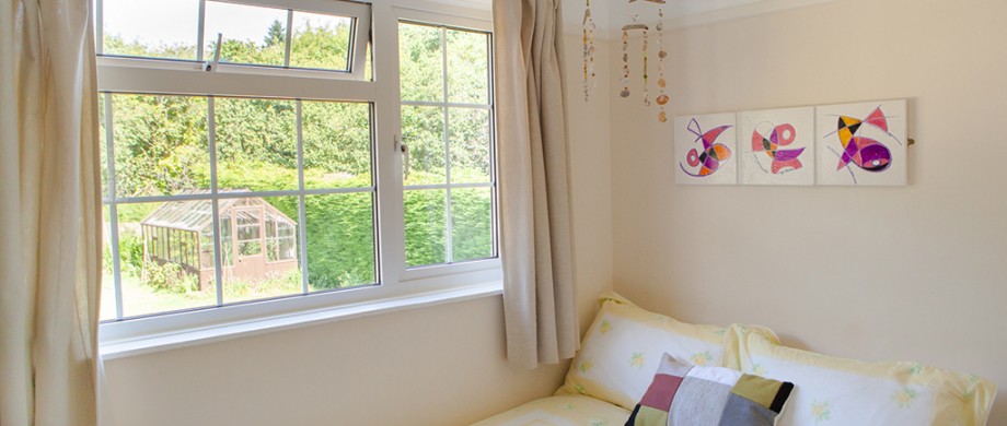 back bedroom with garden views at The Pink House Lulworth Dorset holiday home accomodation