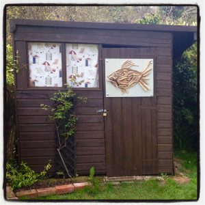 driftwood fish on the garden shed at The Pink House Lulworth Dorset holiday cottage